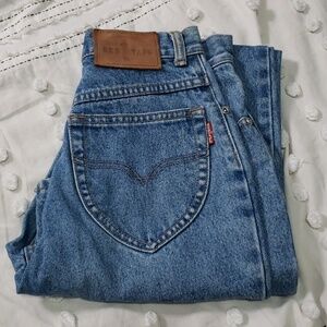 Vintage red taps women's high waisted blue jeans 26x29